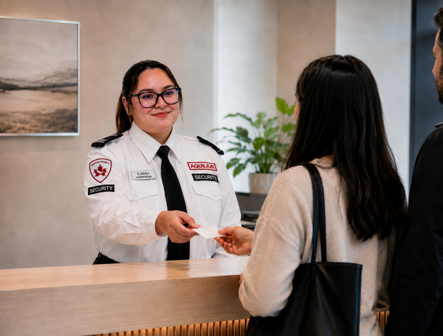 Aquilius concierge officer assisting a resident